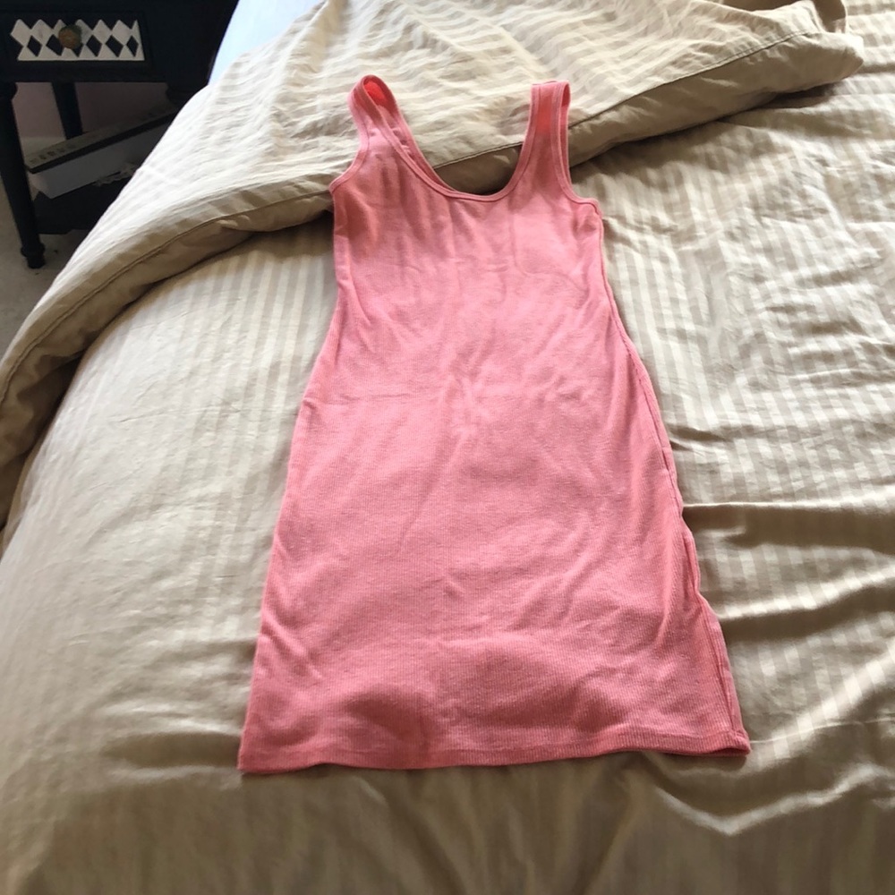 A pink dress. Tightly fitted.